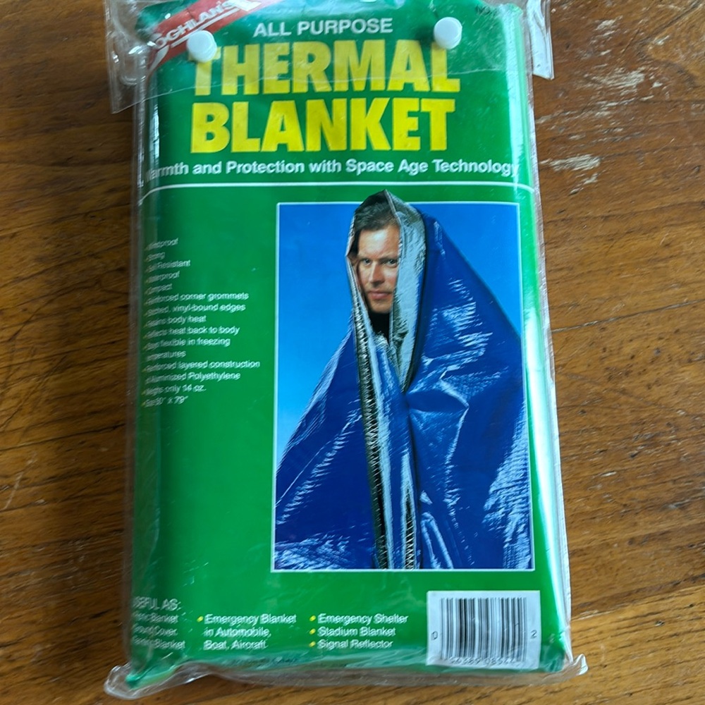 NOS 1998 Coghlan’s All Purpose Thermal Blanket weighs 14 oz. & is 50” x 79”